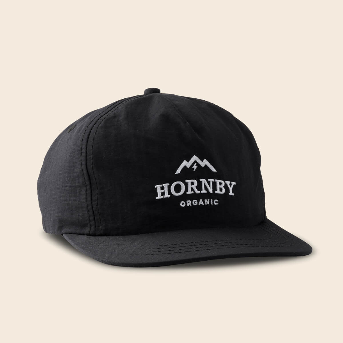 Black cap with 'Hornby Organic' logo on a beige background